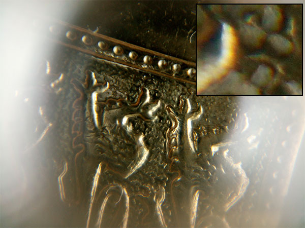 The familiar coin; but now taken with an 18 megapixel camera.